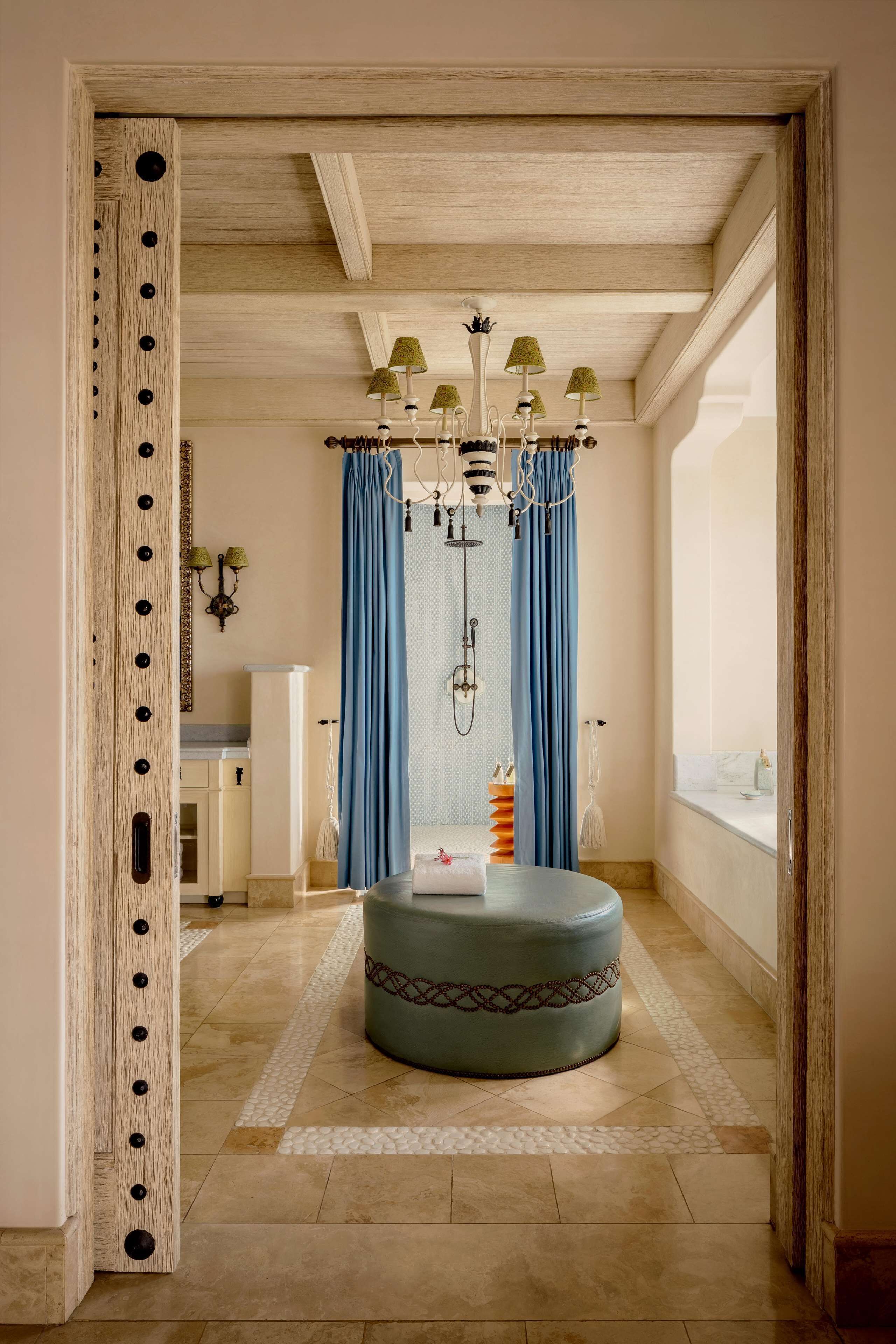 A bathroom with a bathtub, a shower, a toilet, and a sink.