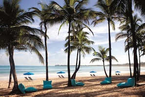 On the beach, beach cabanas, sun loungers, beach umbrellas