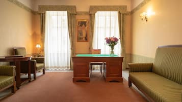 Suite, 1 King Bed, Non Smoking | Minibar, desk, blackout drapes, iron/ironing board