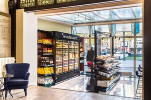 A modern interior with a Wundermart store, a seating area, and a view of the street outside.