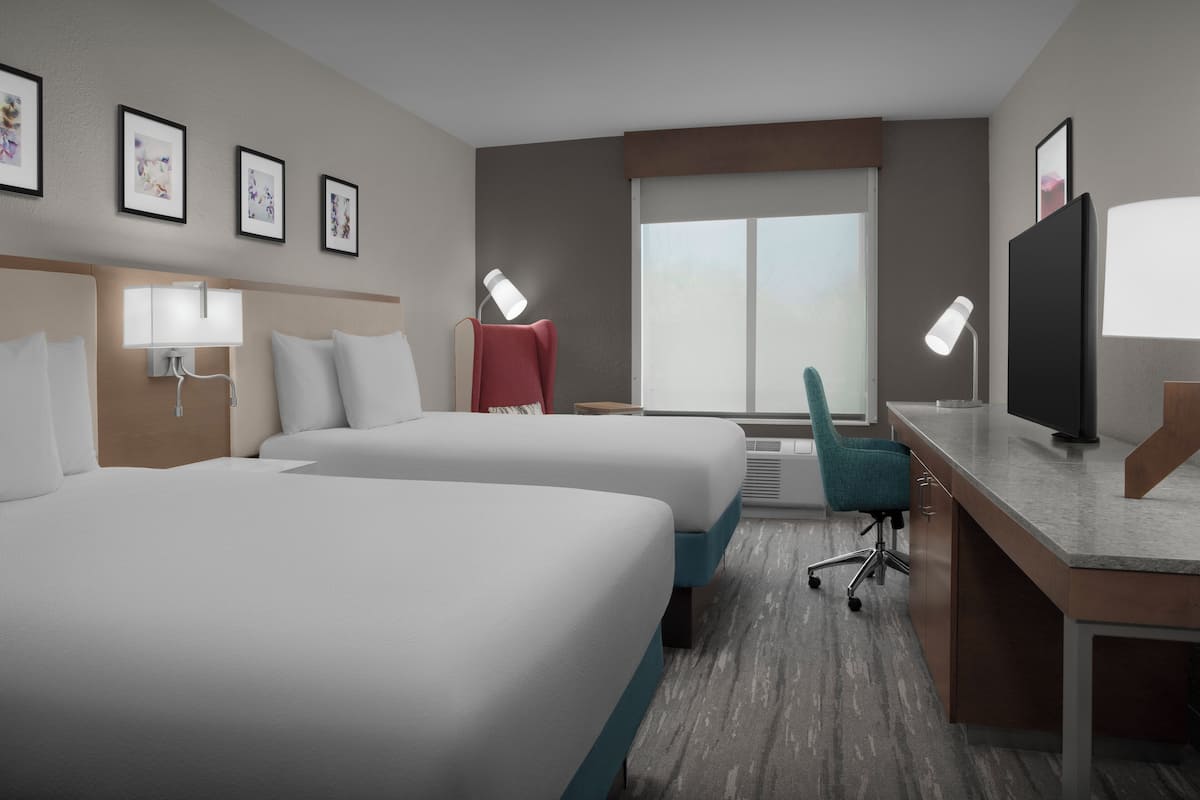 Two double beds one bedroom suite | In-room safe, desk, laptop workspace, iron/ironing board