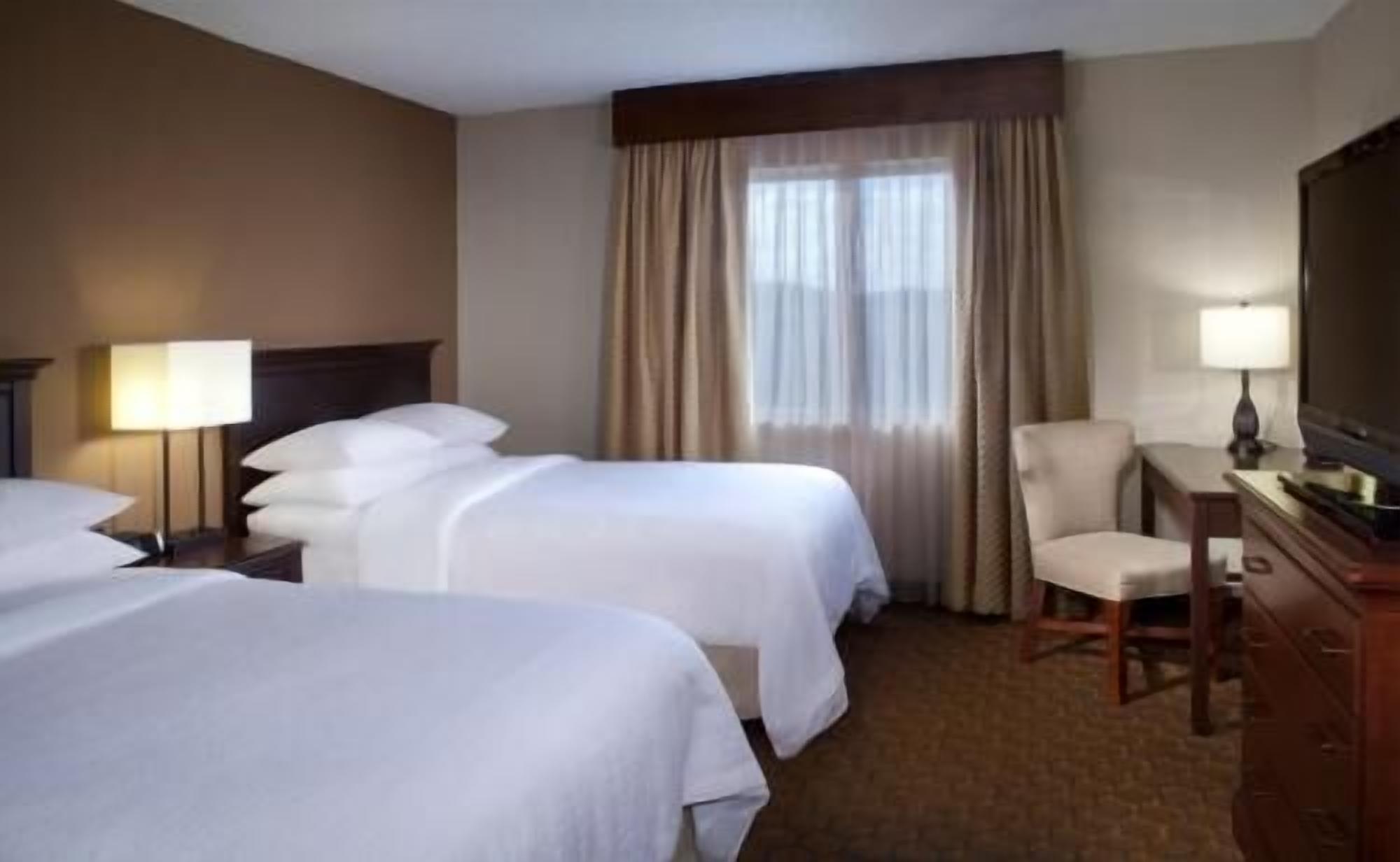 Premium bedding, down comforters, pillowtop beds, in-room safe