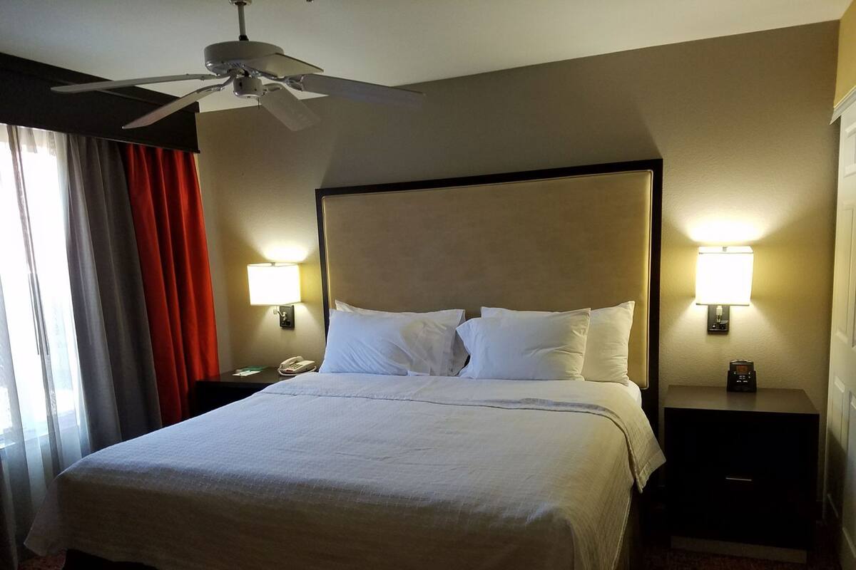 Desk, laptop workspace, blackout drapes, soundproofing