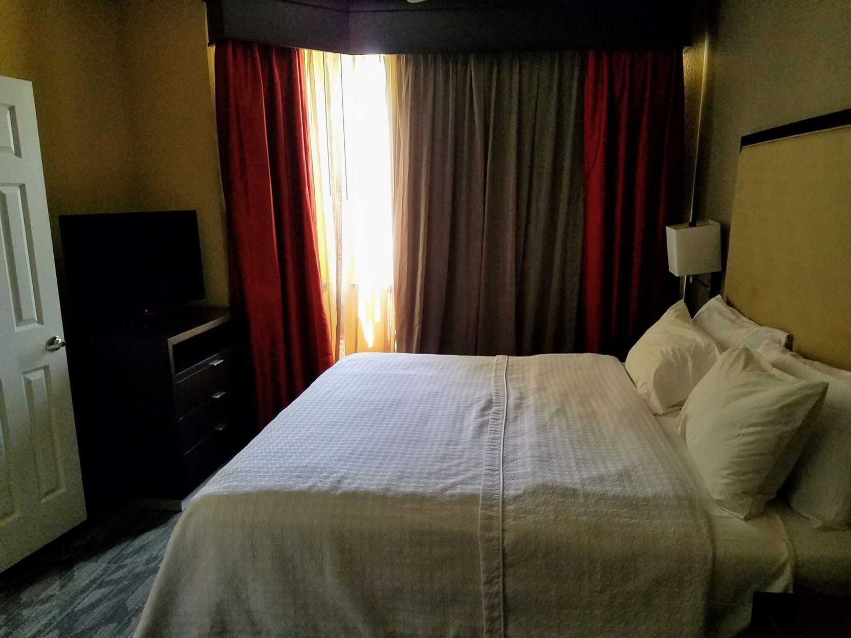 Desk, laptop workspace, blackout curtains, soundproofing