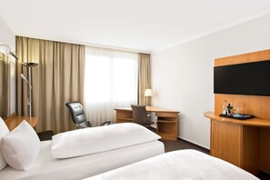 Pillow-top beds, minibar, in-room safe, desk