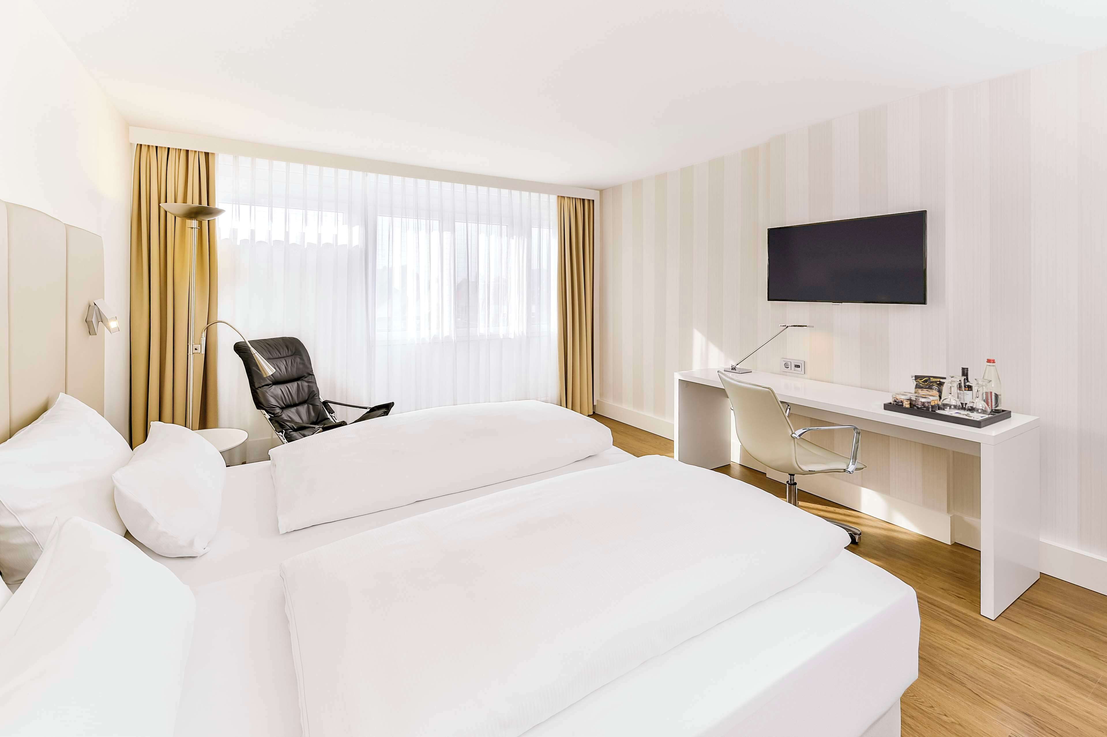 Hypoallergeen beddengoed, een minibar, een kluis op de kamer, een bureau