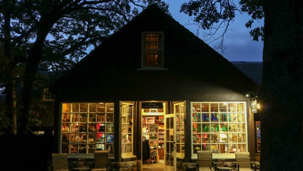 A cozy, well-lit shop with large windows and a welcoming entrance.