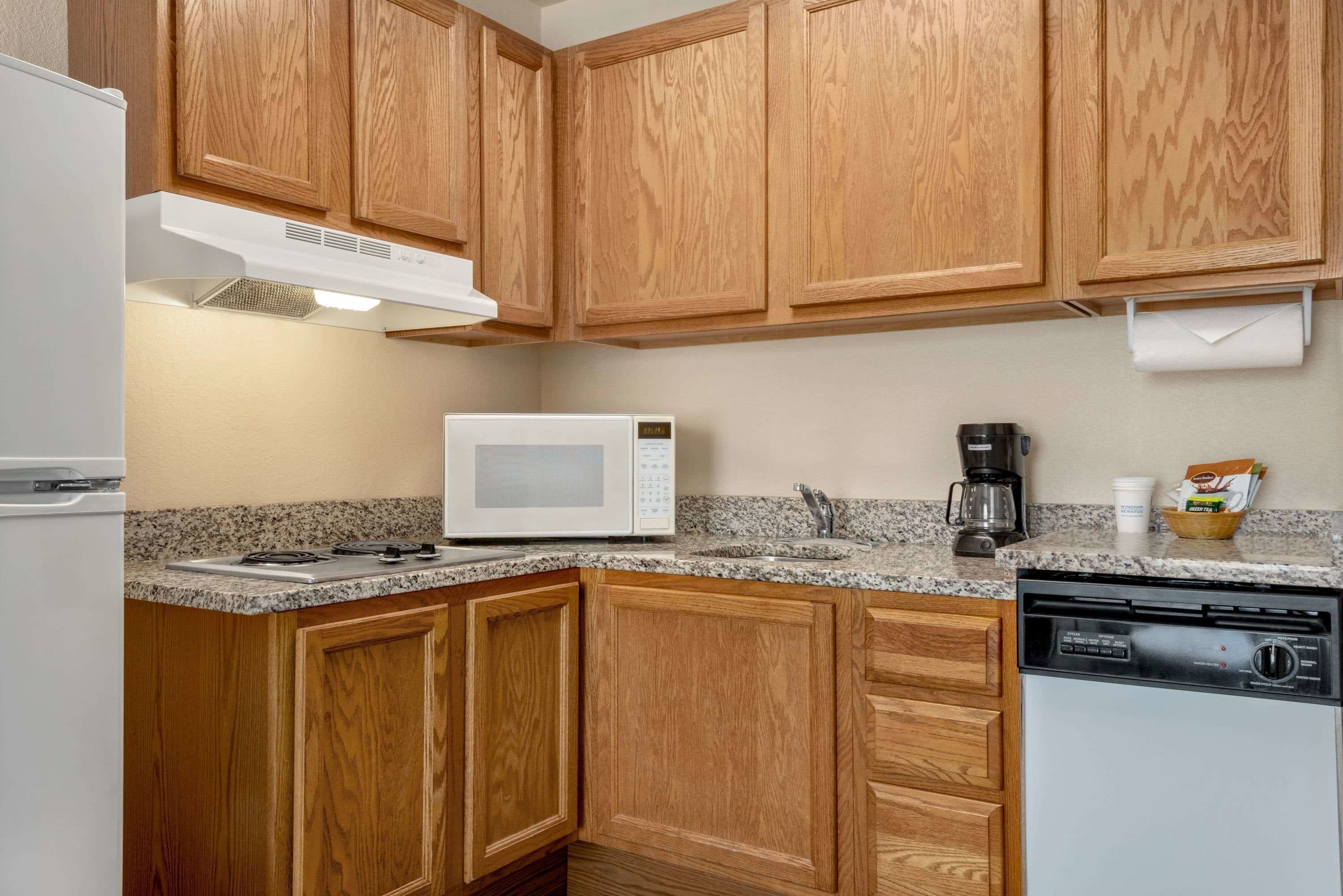 fridge, microwave, coffee/tea maker, cookware/dishes/utensils