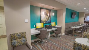A hotel room with a desk, two computers, a chair, a sofa, and a television. - Residence Inn by Marriott Fort Worth Alliance Airport (Fort Worth)
