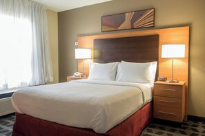 Premium bedding, desk, laptop workspace, blackout drapes