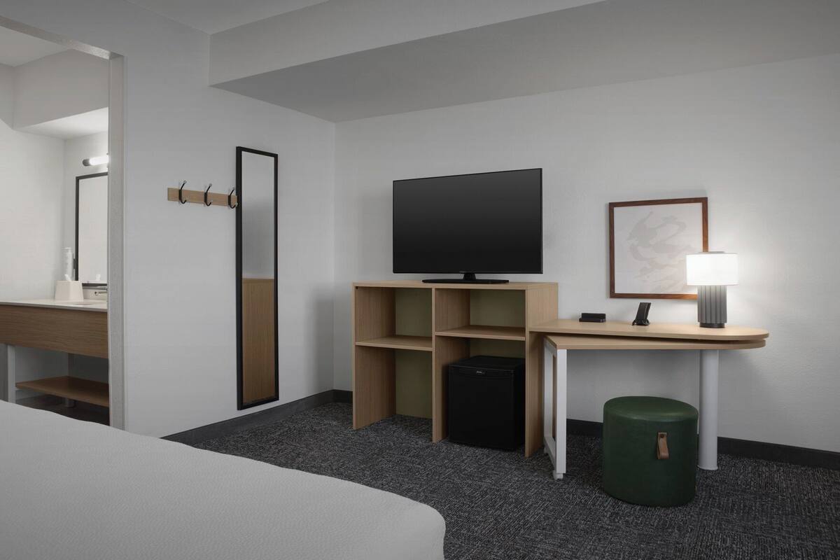 Desk, laptop workspace, blackout curtains, iron/ironing board