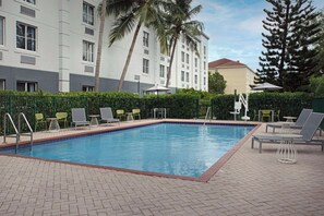 Outdoor pool, pool umbrellas, sun loungers