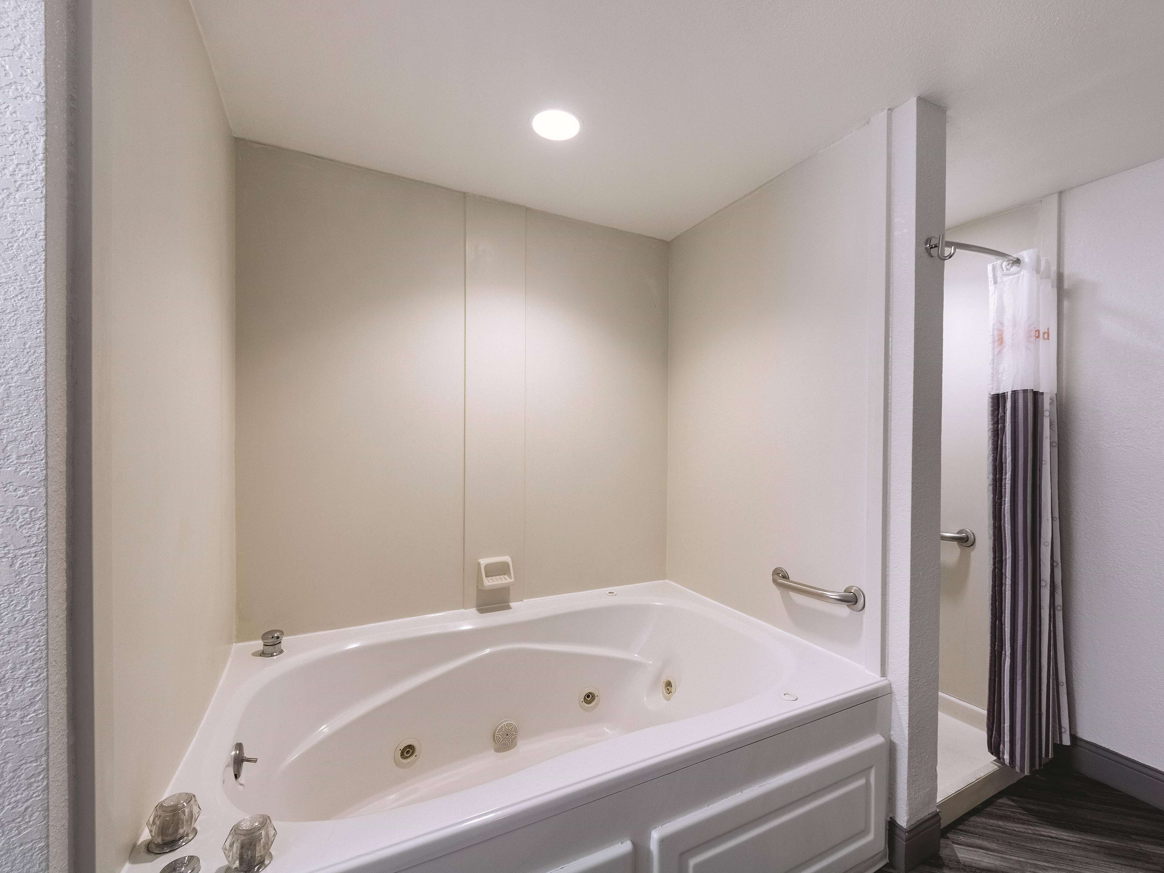 deluxe suite, 1 king bed, non smoking | pillow-top beds, desk, laptop workspace, blackout curtains