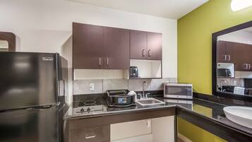 Full-sized fridge, microwave, stovetop, coffee/tea maker