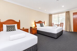 A hotel room with two beds, a desk, a chair, and a window with curtains. - Best Western Ambassador Motor Inn & Apartments (Wagga Wagga)