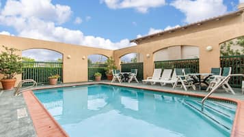 Seasonal outdoor pool, open 6 AM to 10:30 PM, pool umbrellas