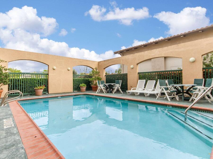 Seasonal outdoor pool, open 6 AM to 10:30 PM, pool umbrellas