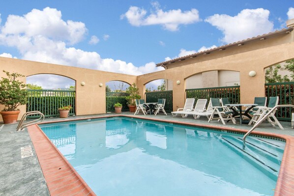 Seasonal outdoor pool, open 6 AM to 10:30 PM, pool umbrellas