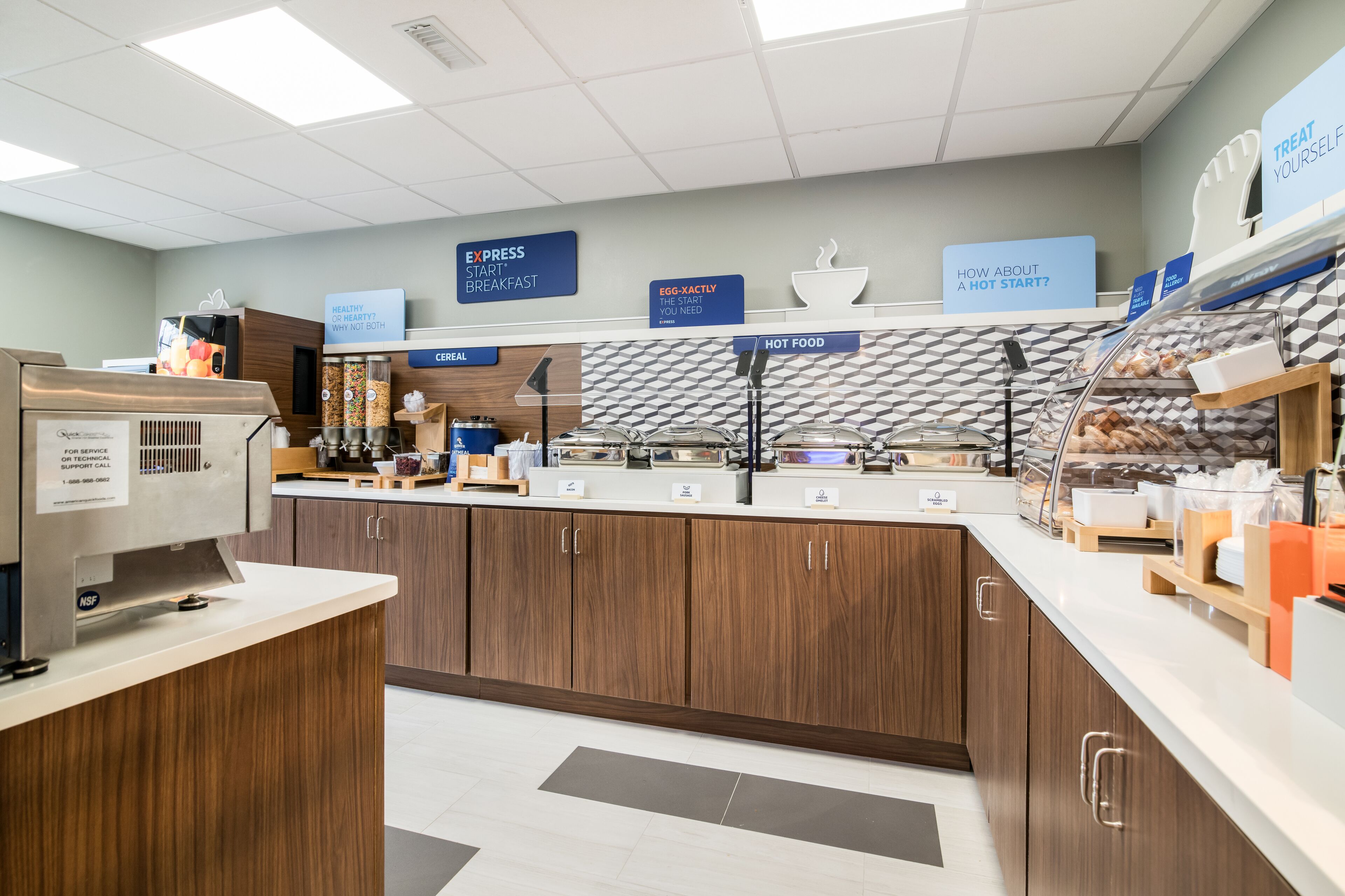 A breakfast area with a self-serve station, cereal, hot food, and a sign promoting a healthy start.