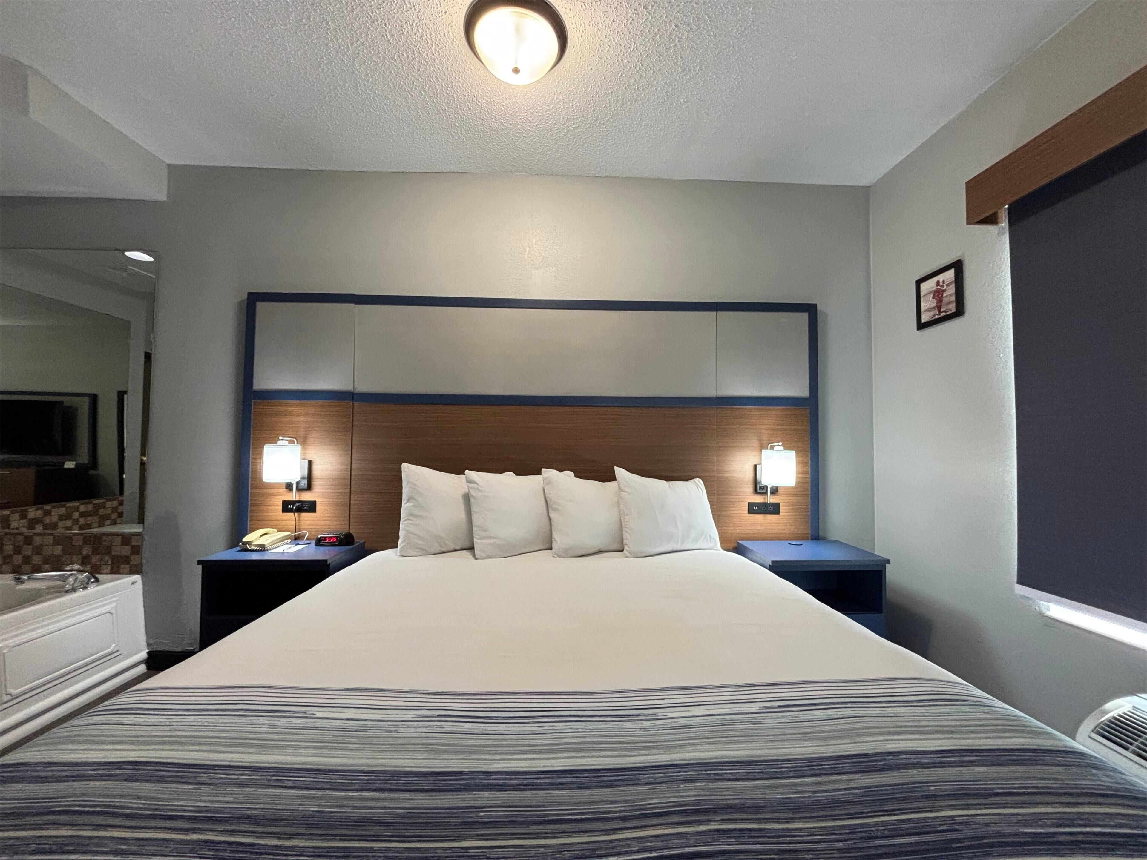 Deluxe Suite, 1 King Bed, Non Smoking | Premium bedding, down comforters, pillowtop beds, blackout drapes