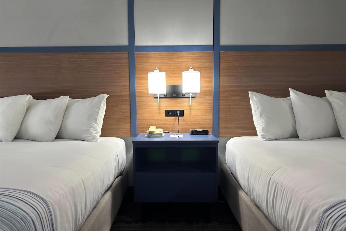 Premium bedding, down duvets, pillow-top beds, blackout curtains