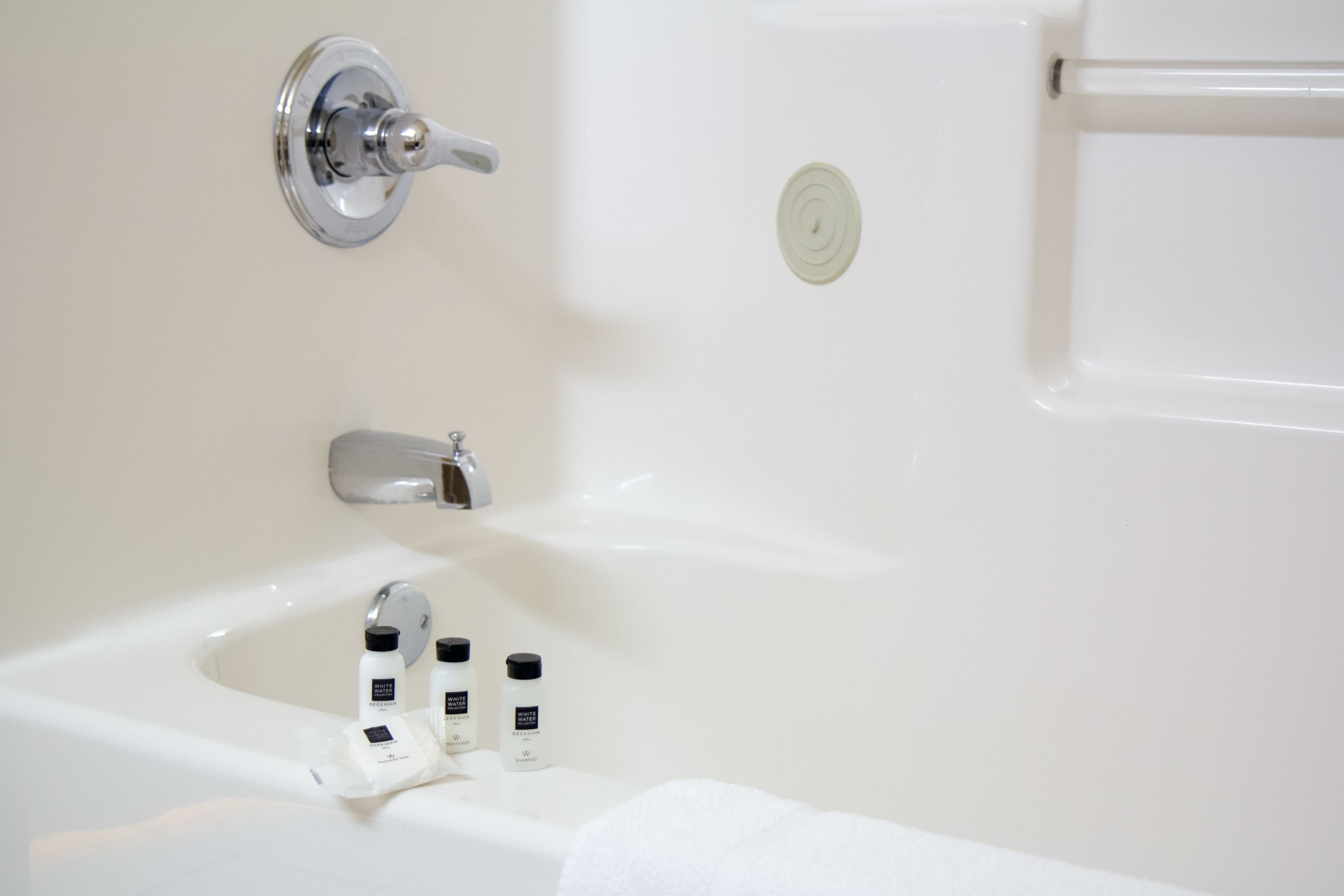 bathtub, free toiletries, hair dryer, towels