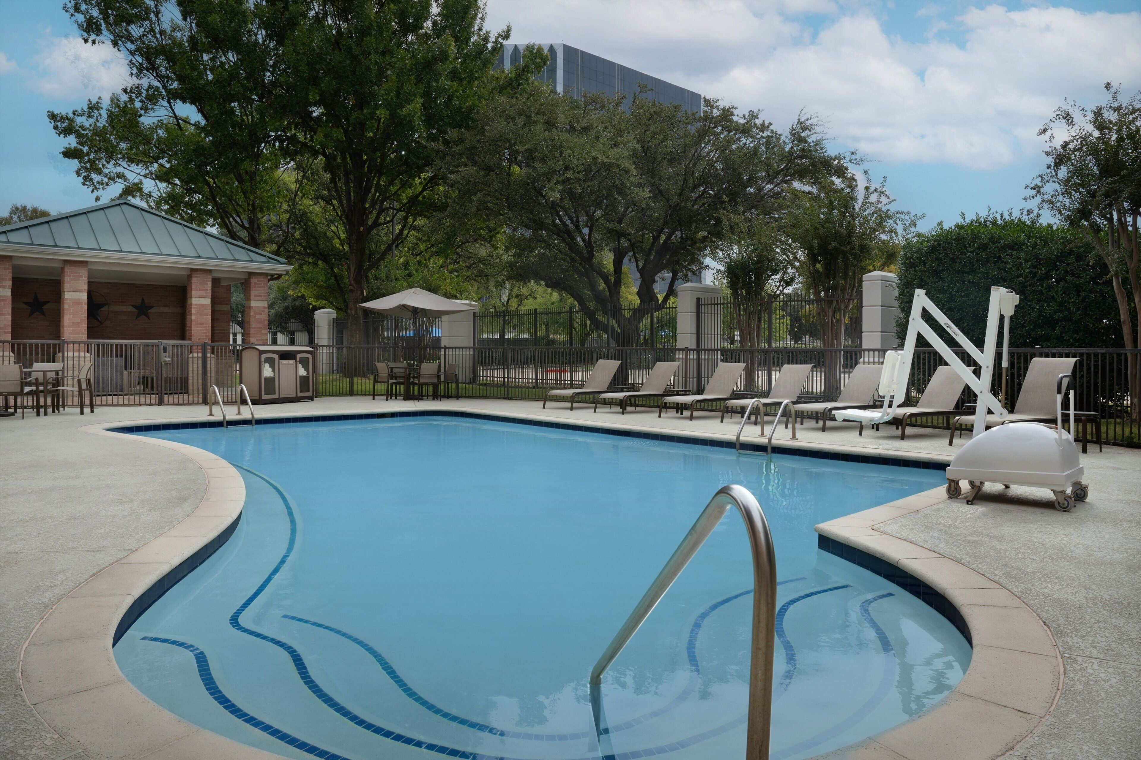 seasonal outdoor pool, open 6:00 am to 10:00 pm, pool umbrellas