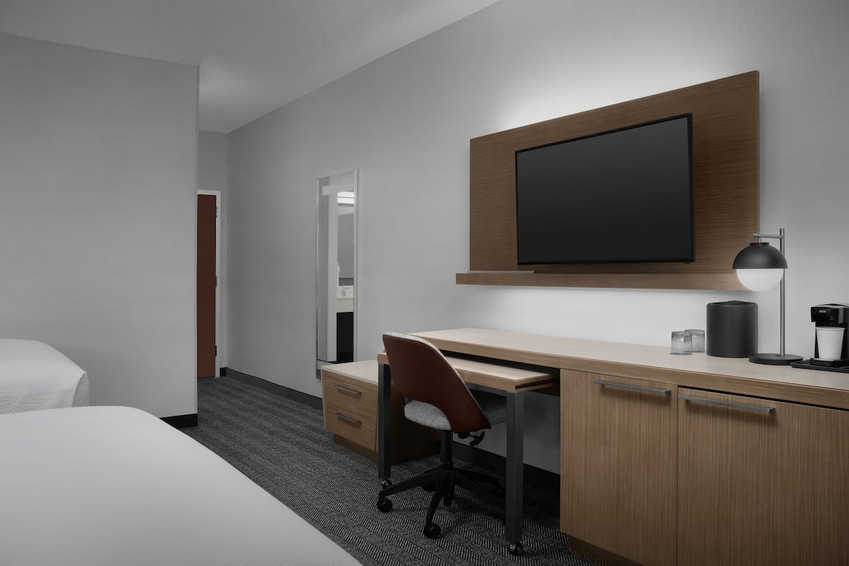 Premium bedding, desk, laptop workspace, blackout curtains