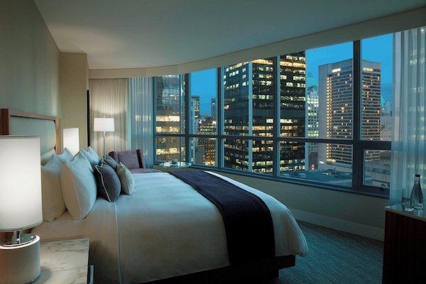 Hypo-allergenic bedding, down duvets, pillow-top beds, in-room safe