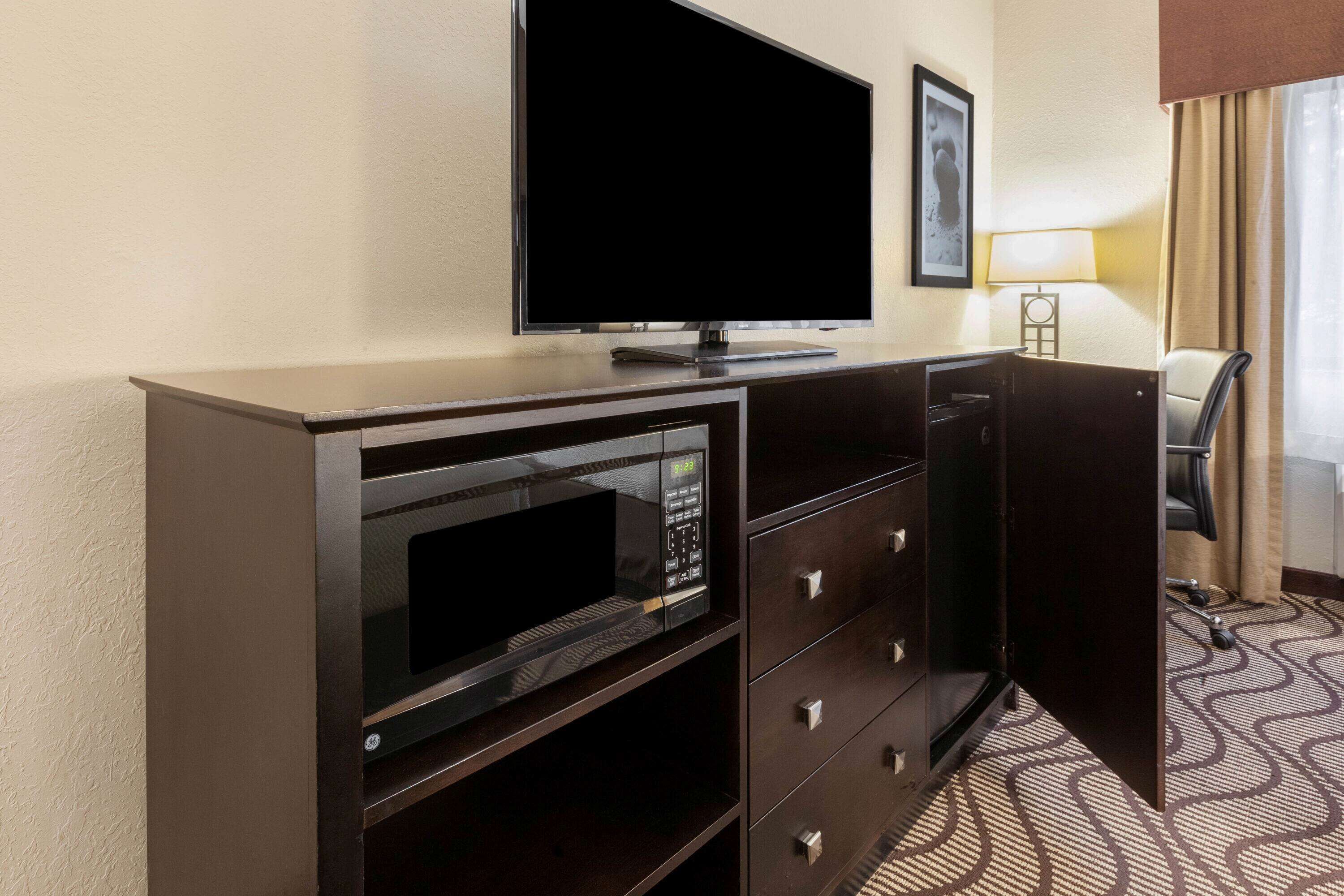 premium bedding, desk, blackout curtains, iron/ironing board