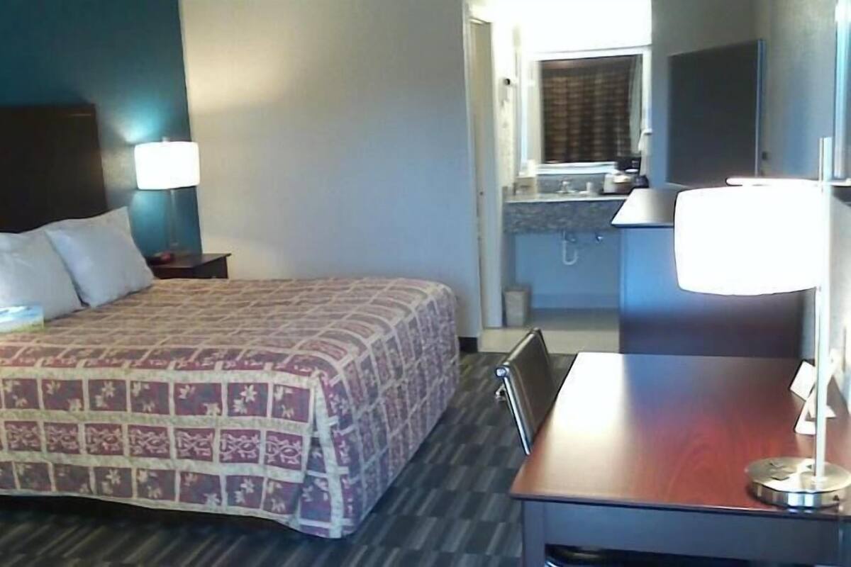 Laptop workspace, blackout drapes, iron/ironing board