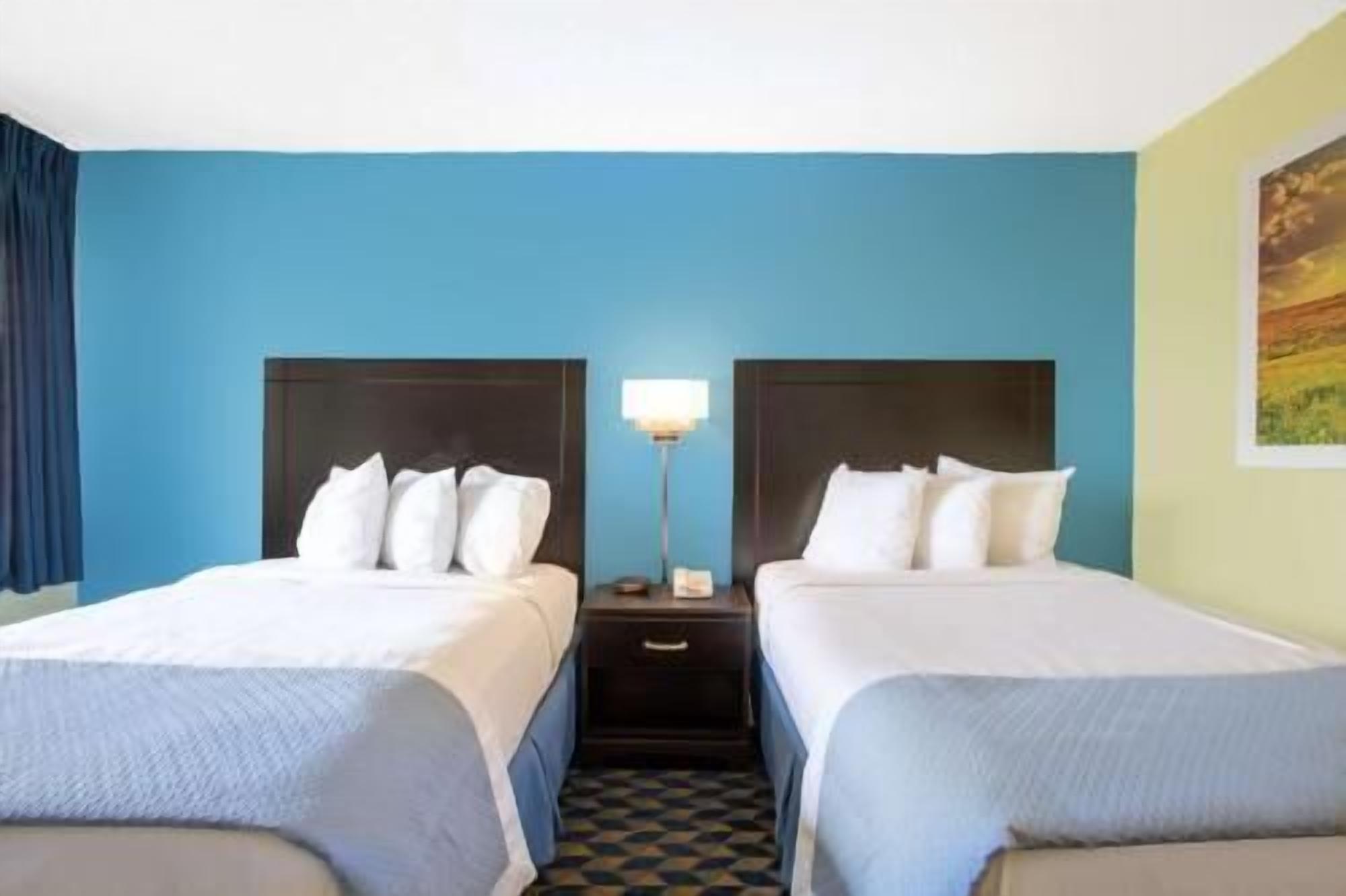 Desk, blackout drapes, iron/ironing board, rollaway beds