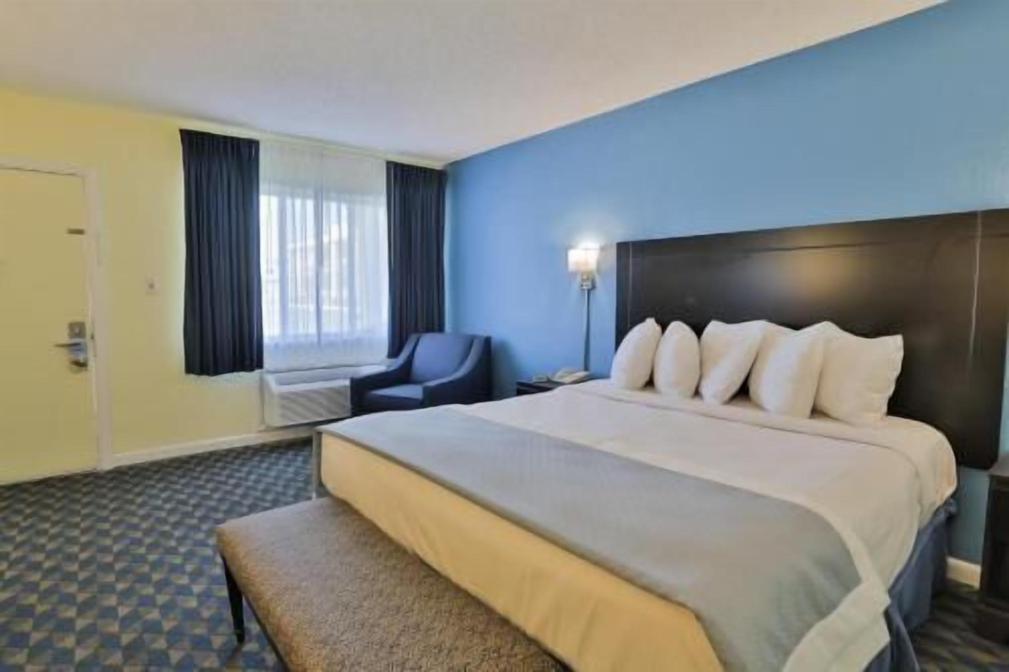 Desk, blackout drapes, iron/ironing board, rollaway beds