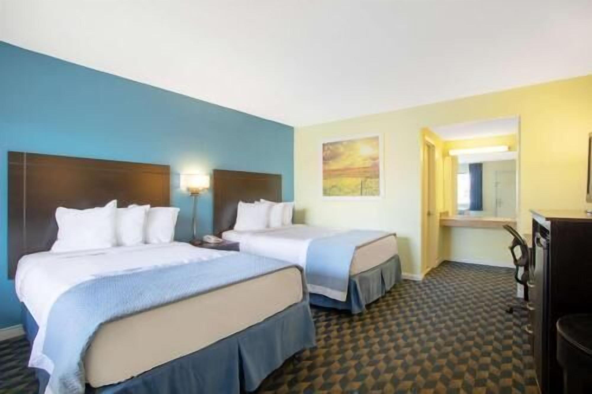 Desk, blackout drapes, iron/ironing board, rollaway beds