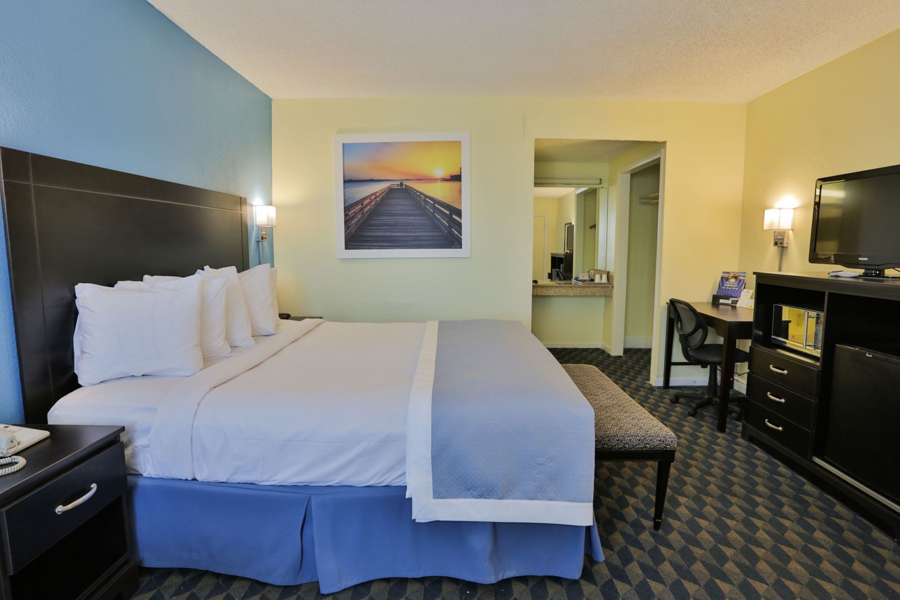 Desk, blackout drapes, iron/ironing board, rollaway beds