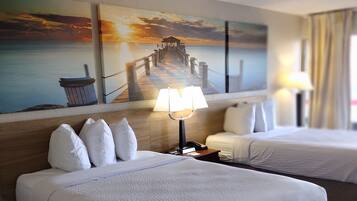 A hotel room with two beds, a nightstand with a lamp, a painting of a pier, and a view of the sea.