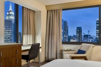 Hotel amenities such as safe, desk and work area at Hilton New York Times Square
