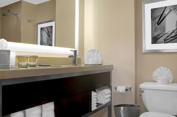 Combined shower/tub, designer toiletries, hair dryer, towels at Hilton New York Times Square