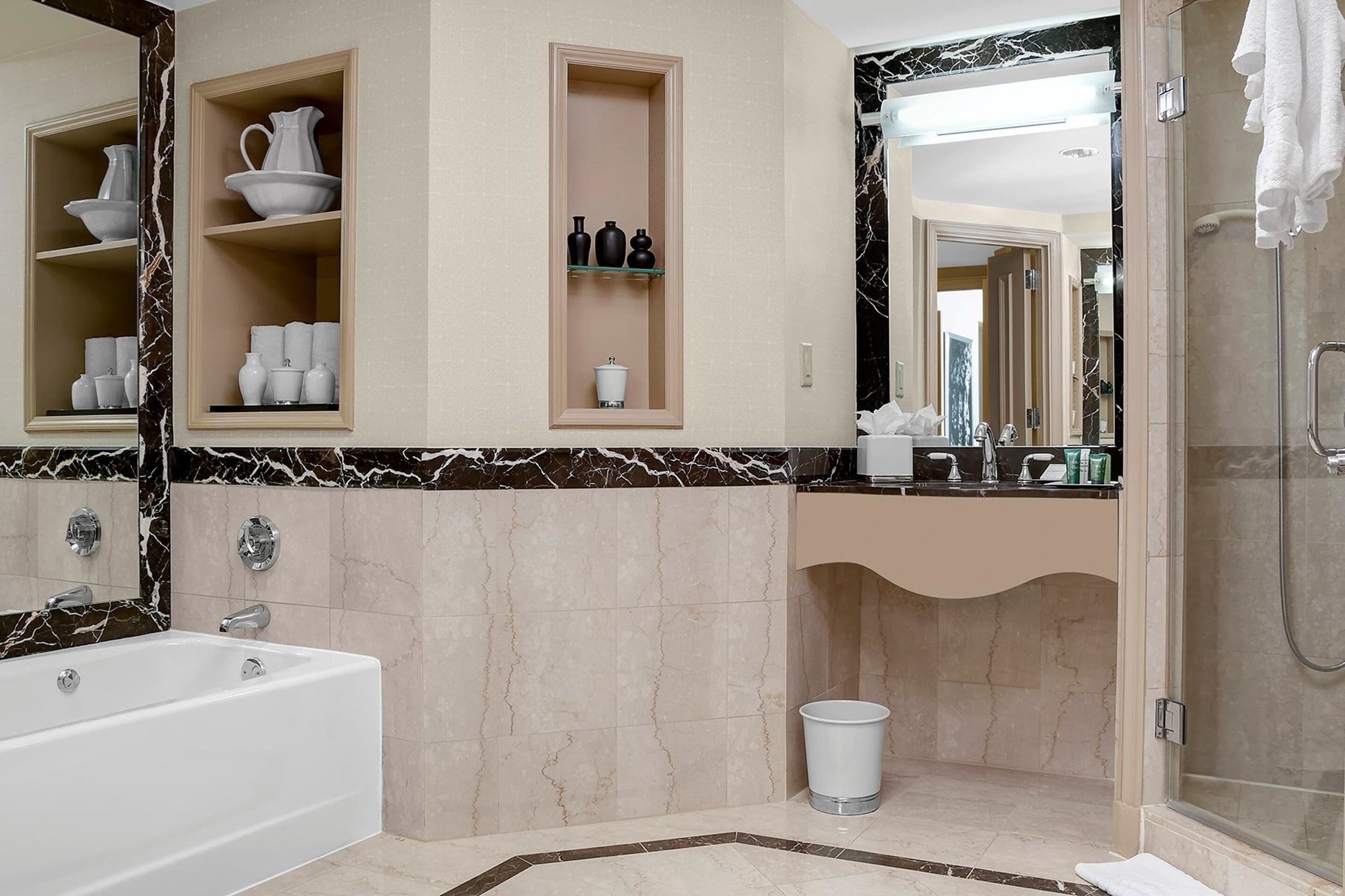 combined shower/bathtub, designer toiletries, hair dryer, bathrobes