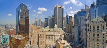 Hotel room view looking out at Hilton New York Times Square
