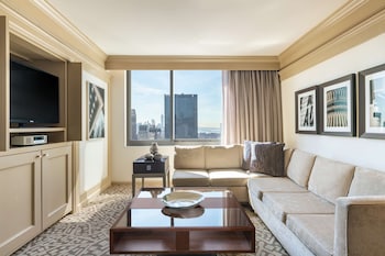 Suite, 1 Bedroom | Living area | 46-inch flat-screen TV with satellite channels, TV, pay movies at Hilton New York Times Square