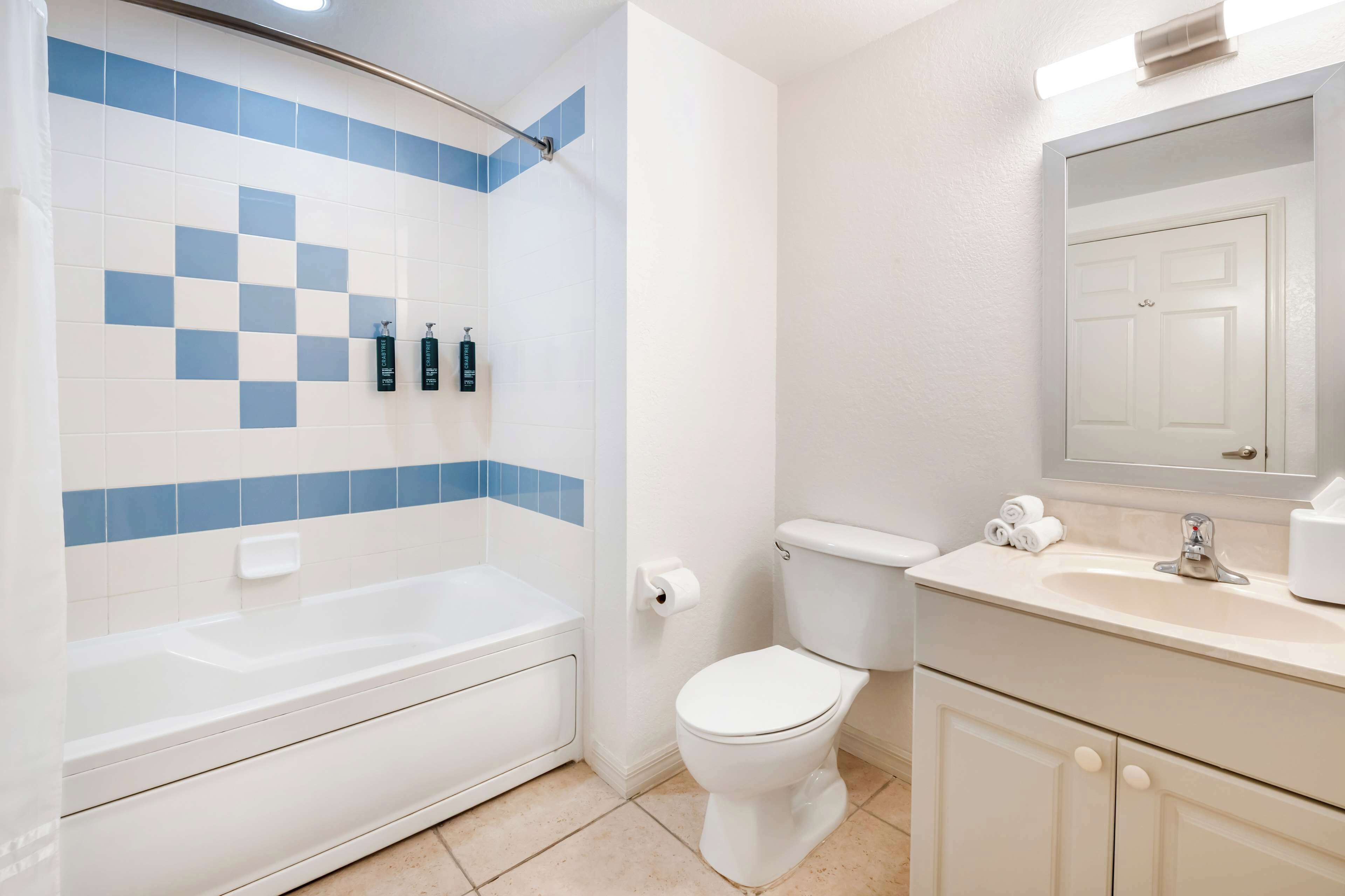 1 bedroom queen suite with balcony and sofabed | bathroom | shower, free toiletries, hair dryer, towels