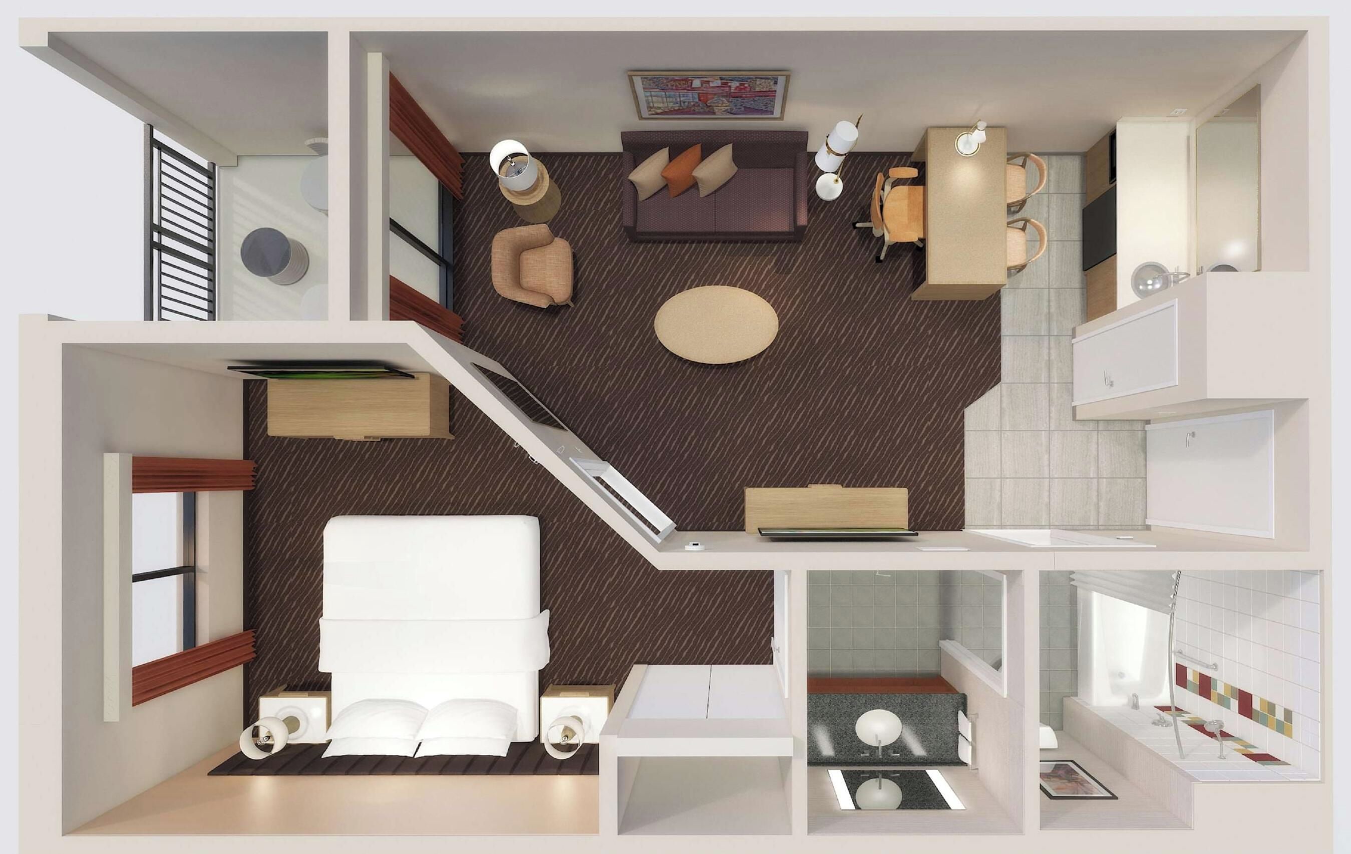 A hotel room with a bed, a desk, a chair, a small table, a sofa, and a bathroom with a sink and toilet.