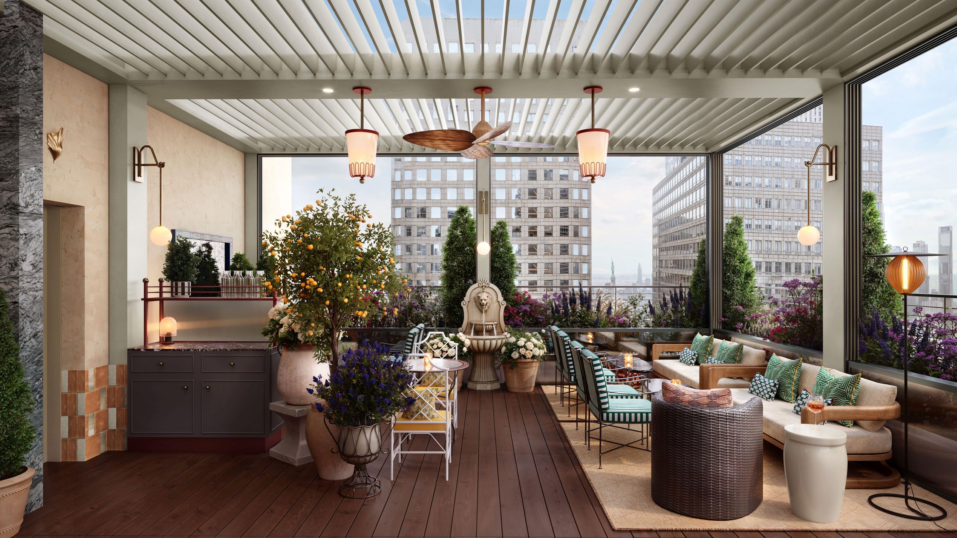 A rooftop terrace with a wooden deck, seating area, and a view of the cityscape.