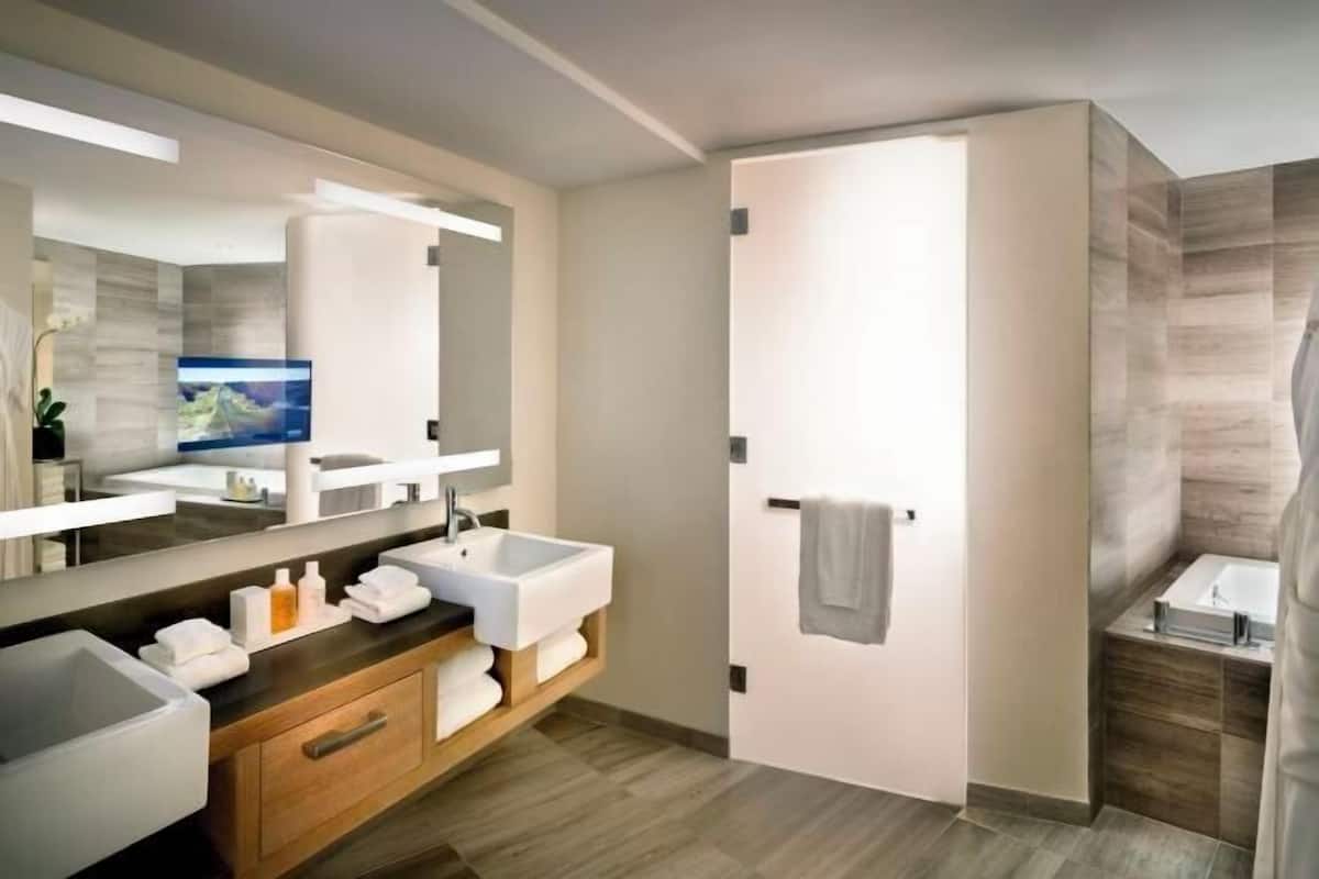 Bathroom | Designer toiletries, hair dryer, bathrobes, slippers