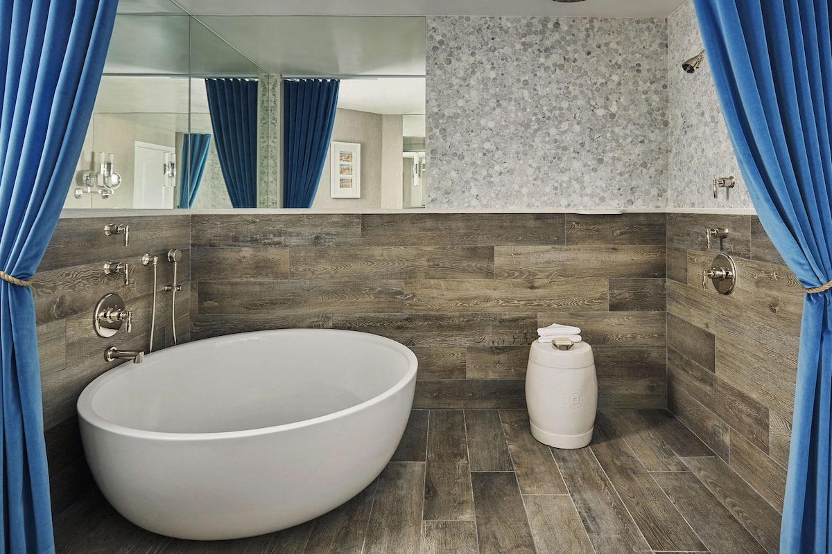 premier bungalow, 1 king bed with sofa bed, patio | bathroom | combined shower/bathtub, designer toiletries, hair dryer, bathrobes