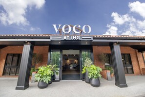 A building with a sign reading "VOCO BY IHG".
