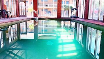 Indoor pool, open 9:00 AM to 8:00 PM, pool loungers