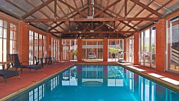 Indoor pool, open 9:00 AM to 8:00 PM, pool loungers