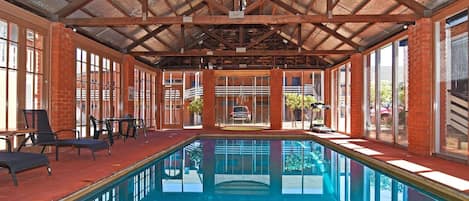 Indoor pool, open 9:00 AM to 8:00 PM, pool loungers